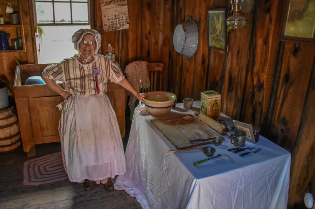 Angie Rabbitz dressed in attire of the 1860s makes "stove rags" in the summer kitchen, which is outside of the main house during Patchtown Days on Saturday, June 20, 2026 at Eckley Miners' Village. "Stove rags" are leftover mashed potatoes flattened and fried on the summer kitchen stove top. (Frank Barr / Contributing Photographer)