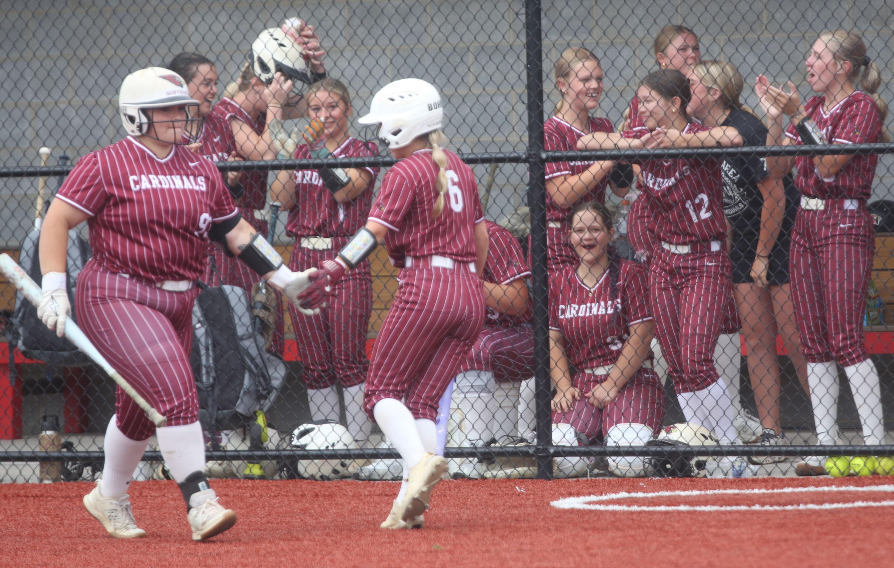 Pine Grove Tailyn Bohr (6) celebrates withJamie Dinger (99) after...