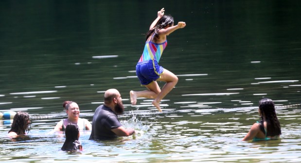 People cool off at Locust Lake State Park in Barnesville on Monday, June 29, 2026. (John Haeger / Staff Photographer)