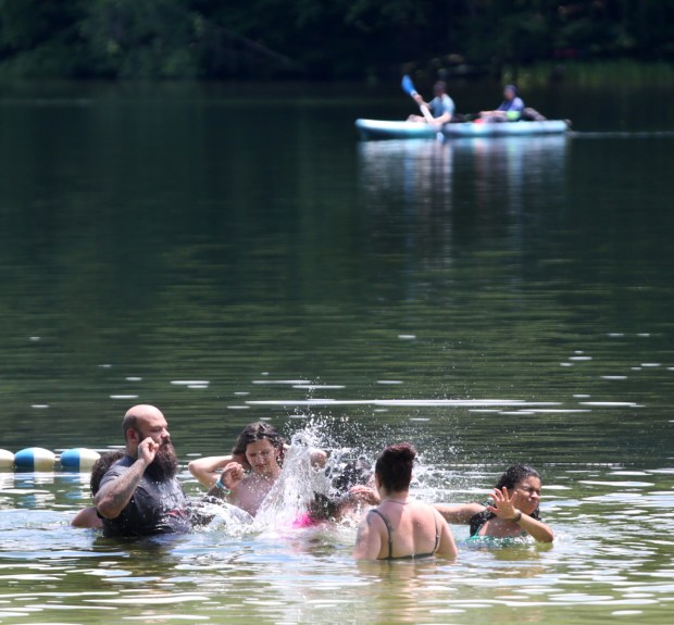 People cool off at Locust Lake State Park in Barnesville on Monday, June 29, 2026. (John Haeger / Staff Photographer)