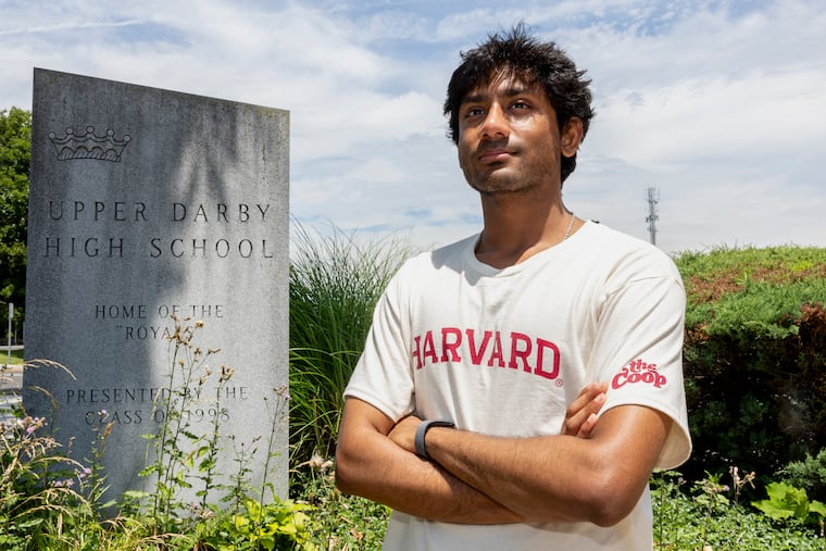 Khandakar Mahin stands for a portrait at Upper Darby High School this month. He is headed to Harvard this fall and hopes to pursue a career in AI ethics and policy.