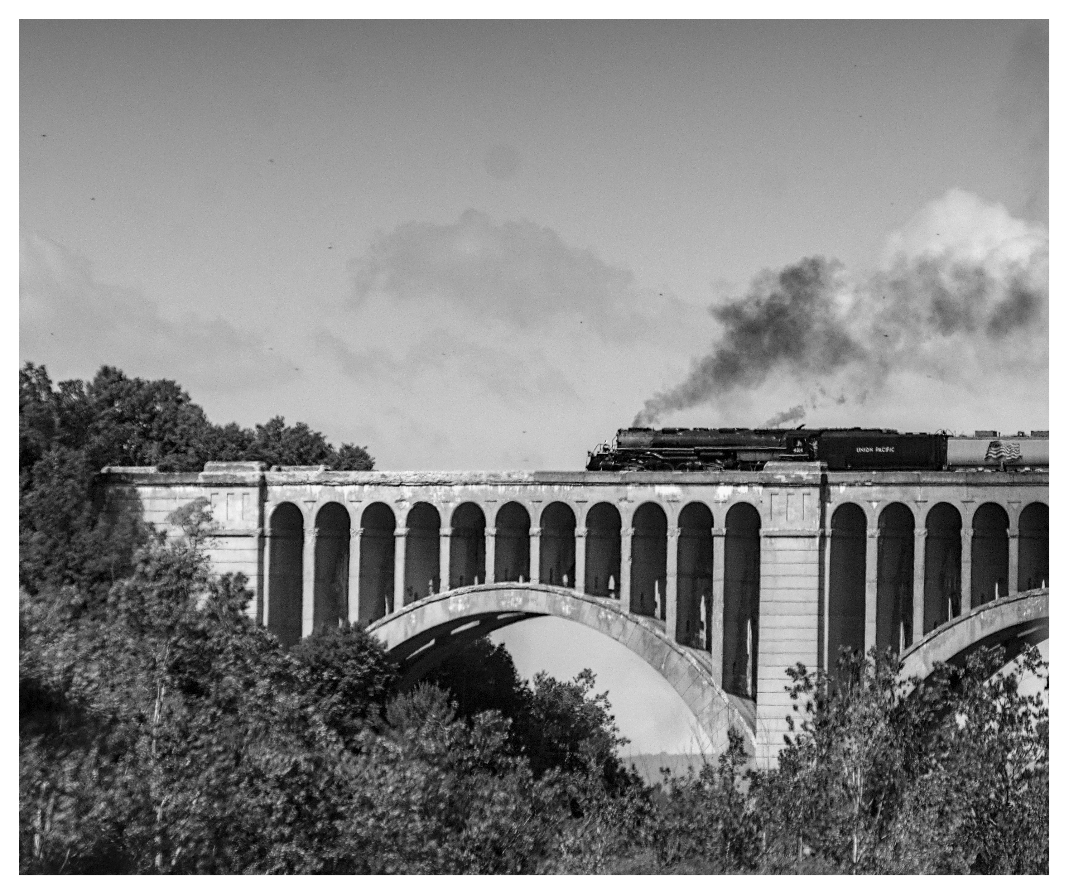 A black & white image of Big Boy crossing the...