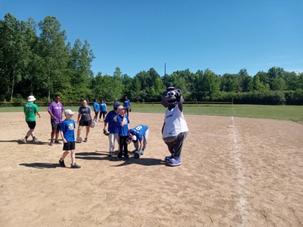 Lake Erie Crushers mascot Stomper having a good time playing with the participants in the Play Ball Weekend at Volunteer Field, which is located on the border of Sheffield Village and Sheffield Lake. (Bob Stascak - For The Morning Journal)