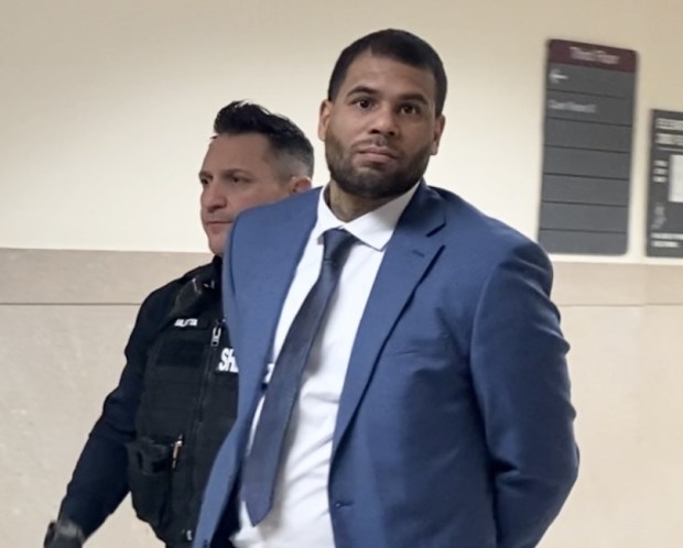 Jovan McCreary is escorted by a deputy sheriff to his trial in Montgomery County Court. (Photo by Carl Hessler Jr. - MediaNews Group)