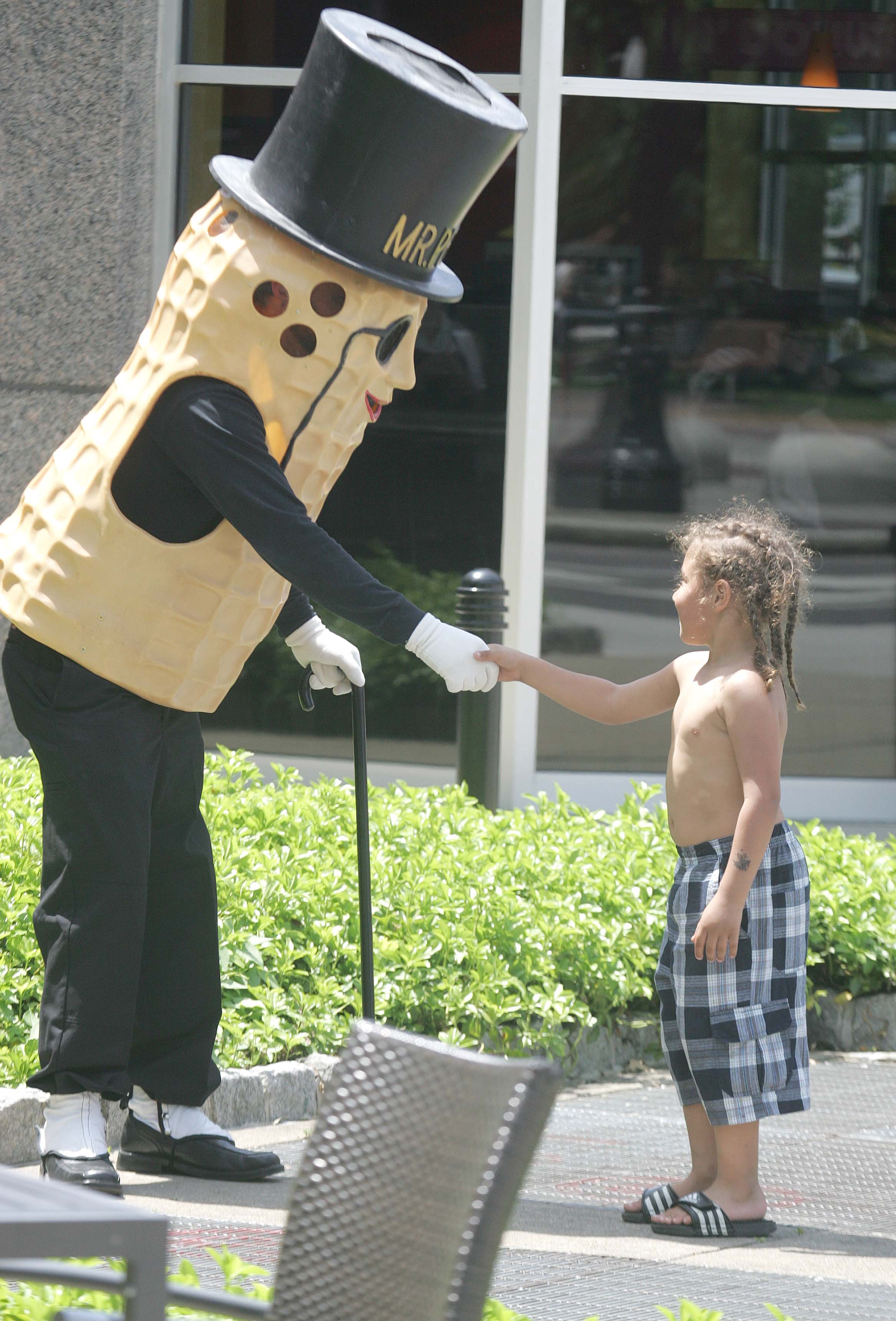 Mr. Peanut greet Jamie Hernandez,5, of Miners Mills. The icon...