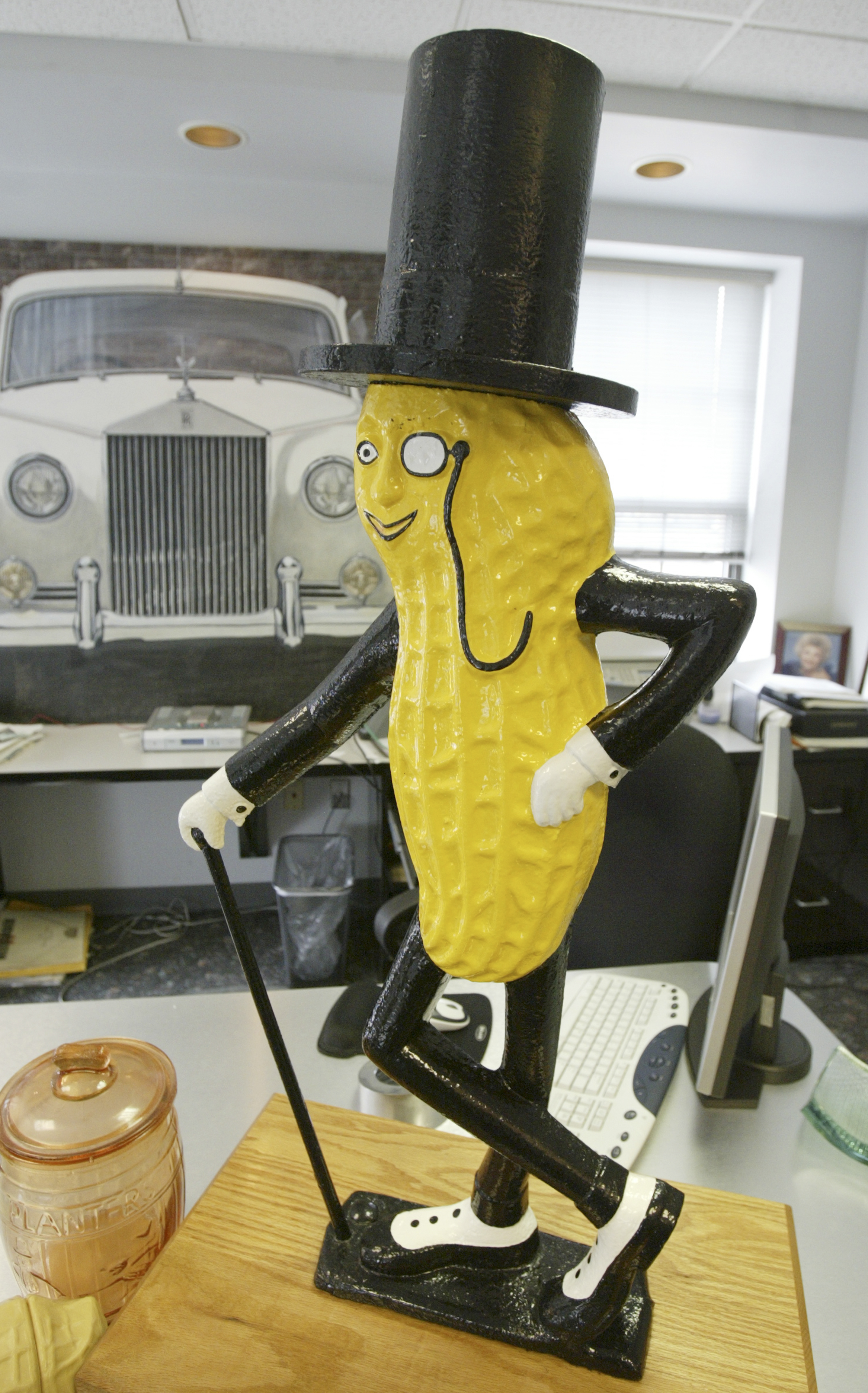 Cast iron Mr. Peanut that once adorned the top of...