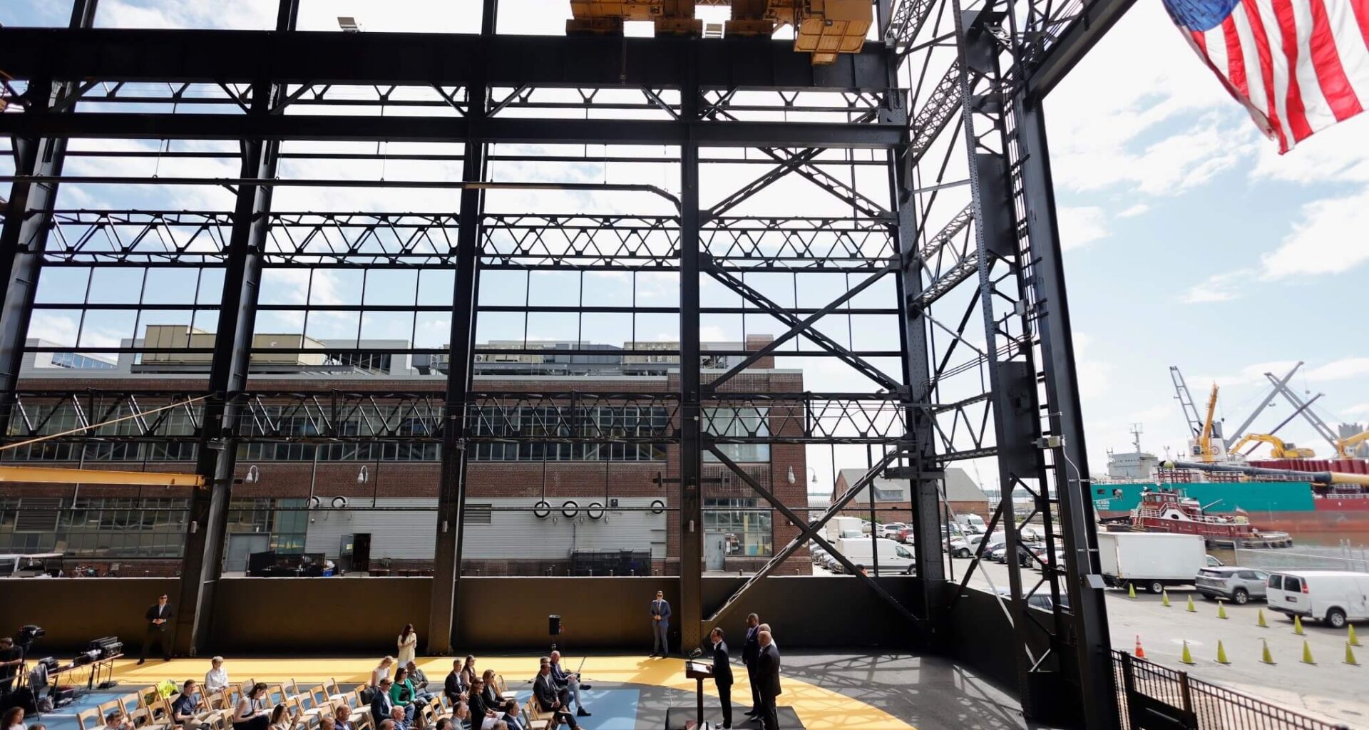 Pennsylvania Governor Josh Shapiro speaking from a podium at Urban Outfitters, Inc.