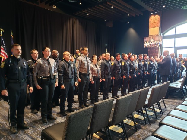 Member of the 50th anniversary Reading Police Academy graduating class stand united after a final class roll call in the Redner's Event Center at FirstEnergy Stadium on Friday, June 26, 2026. (MICHELLE LYNCH/READING EAGLE)