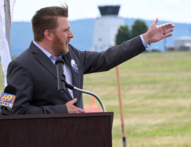Reading Regional Airport Director Zachary Tempesco, airport director, points to where new hangars will be located during a groundbreaking at the airport in Bern Township on Thursday, June 25, 2026. (BILL UHRICH/READING EAGLE)