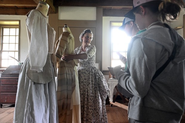Aldona Jones of Spring City, Chester County, talks about women's attire in the late 18th century during the Colonial 250th Anniversary Celebration at the Daniel Boone Homestead in Exeter Township on Saturday, June 27, 2026. (BILL UHRICH/READING EAGLE)