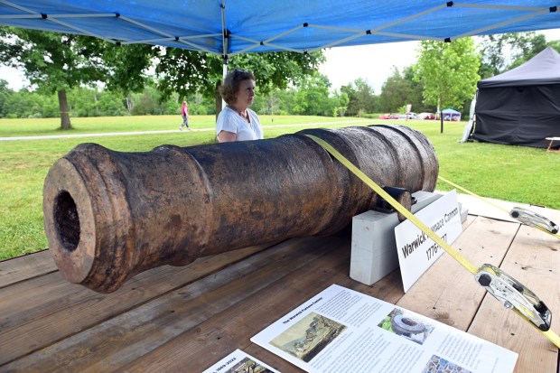 Penny Hunt of the French and Pickering Creeks Conservatoin Trust talks about a Warwick Furnace Cannon that was made during the Revolutionary War during the Colonial 250th Anniversary Celebration at the Daniel Boone Homestead in Exeter Township on Saturday, June 27, 2026. (BILL UHRICH/READING EAGLE)