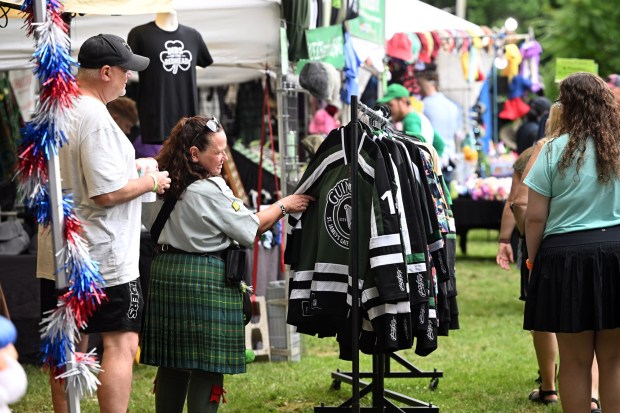 Shoppers browse clothing for sale during the Berks Celtic Fest at the Reading Liederkranz  on Saturday. (BILL UHRICH/READING EAGLE)