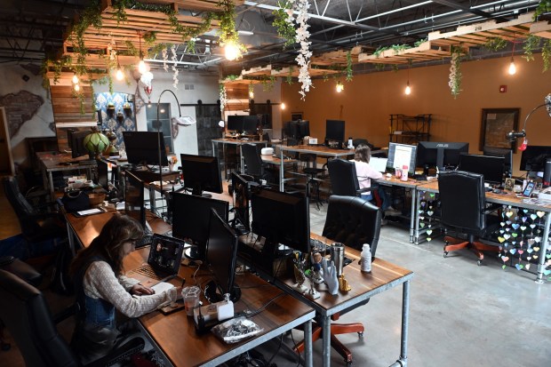 The work corral at NeoPangea, a design and marketing firm at 215 S. Fifth Ave., West Reading, is an open space to encourage interaction among staffers. (BILL UHRICH/MEDIANEWS GROUP)