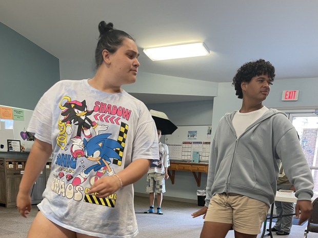 Kasey O'Mara as Papa Ge, the Sly Demon of Death, and Brian Hood as Agwe, the God of Water, guide Ti Moune through her adventure in the Reading Community Players youth musical 'Once on This Island JR.'  (Photo courtesy of Debbi Silas, Reading Community Players)