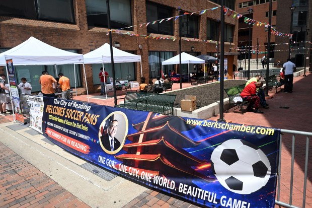 A World Cup Soccer watch party was held in the courtyard in the 600 block of Court Street as fans watched the Mexico against South Africa match. (BILL UHRICH/READING EAGLE)