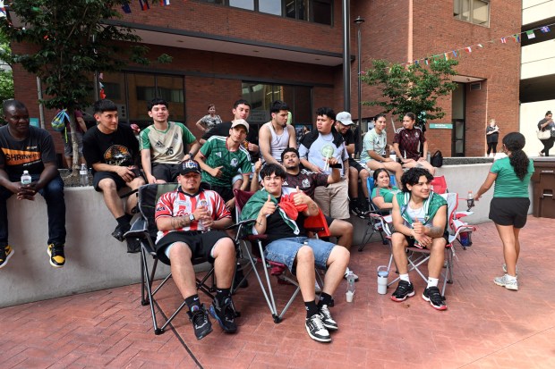 A World Cup Soccer watch party was held in the courtyard in the 600 block of Court Street as fans watched the Mexico against South Africa match. (BILL UHRICH/READING EAGLE)