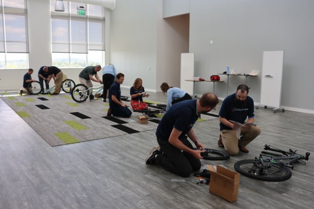 UGI Energy Services employees in Wyomissing recently assembled new bicycles and donated them, along with bike helmets, to Big Brothers Big Sisters of Berks County for local children. (Courtesy of UGI Energy Service)