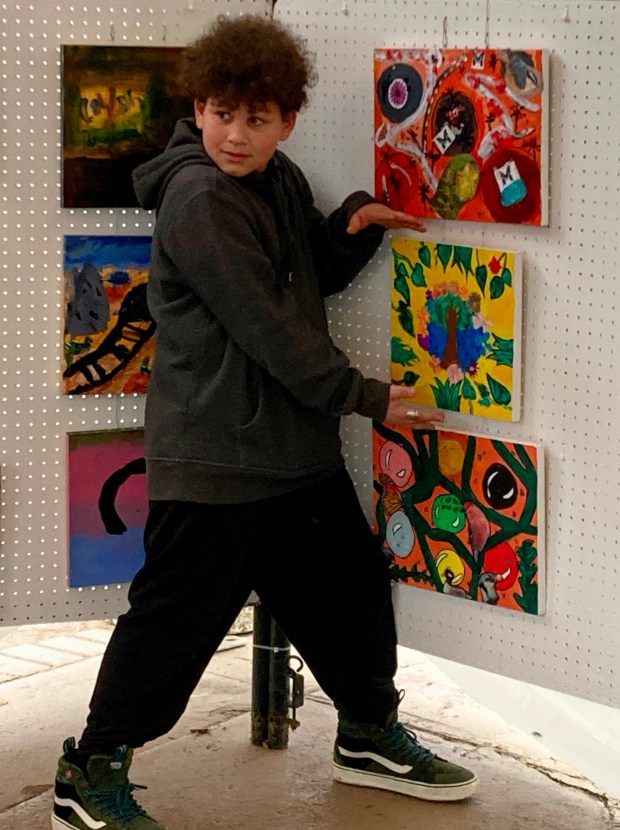 Hal Gonzalez of Heights-Murray Elemtary School showing his painting at Fine Arts Fiesta in Wilkes-Barre in May. (SUBMITTED)
