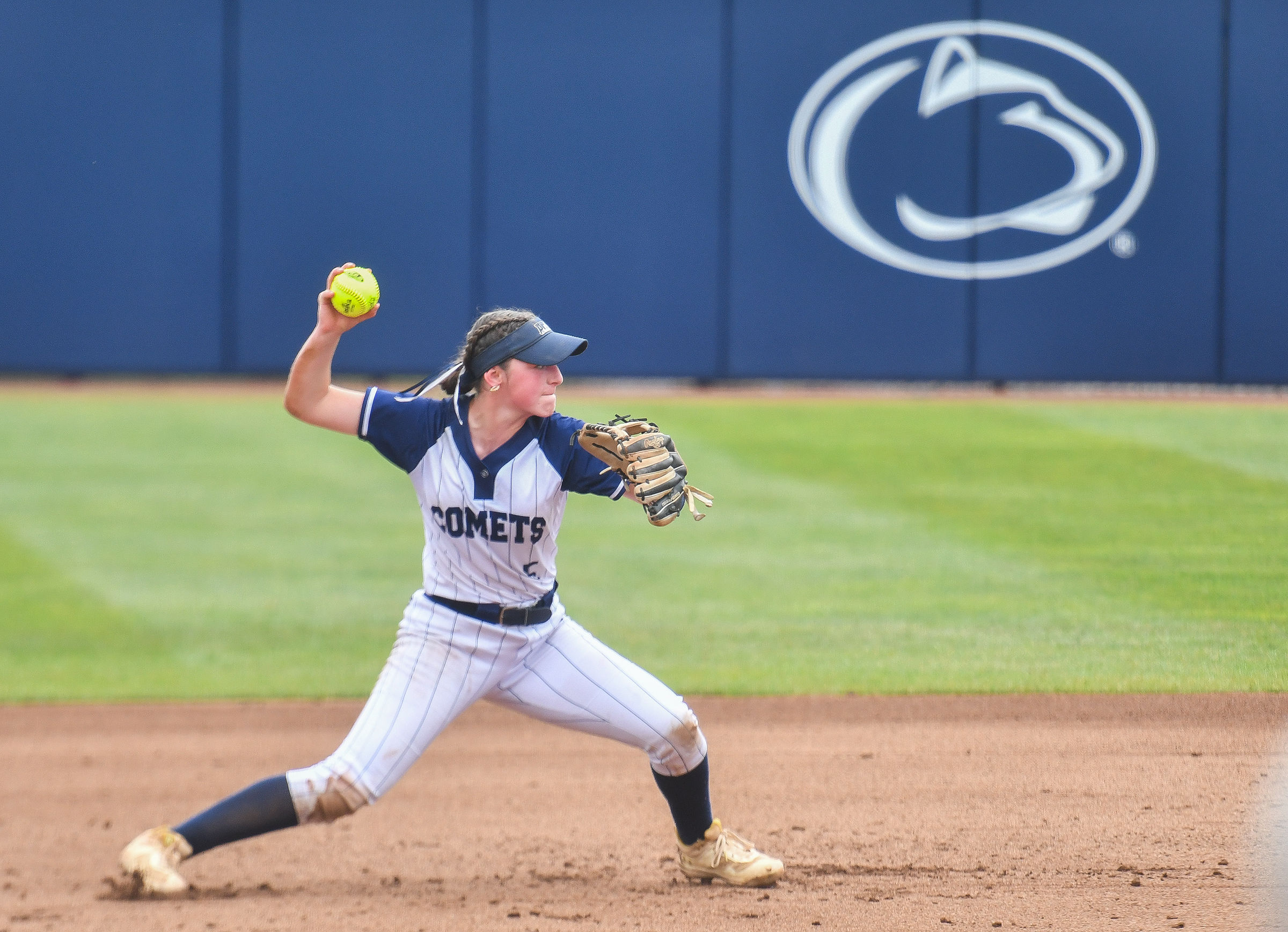 Abington Heights’ Eva Kane throws to first base during the...