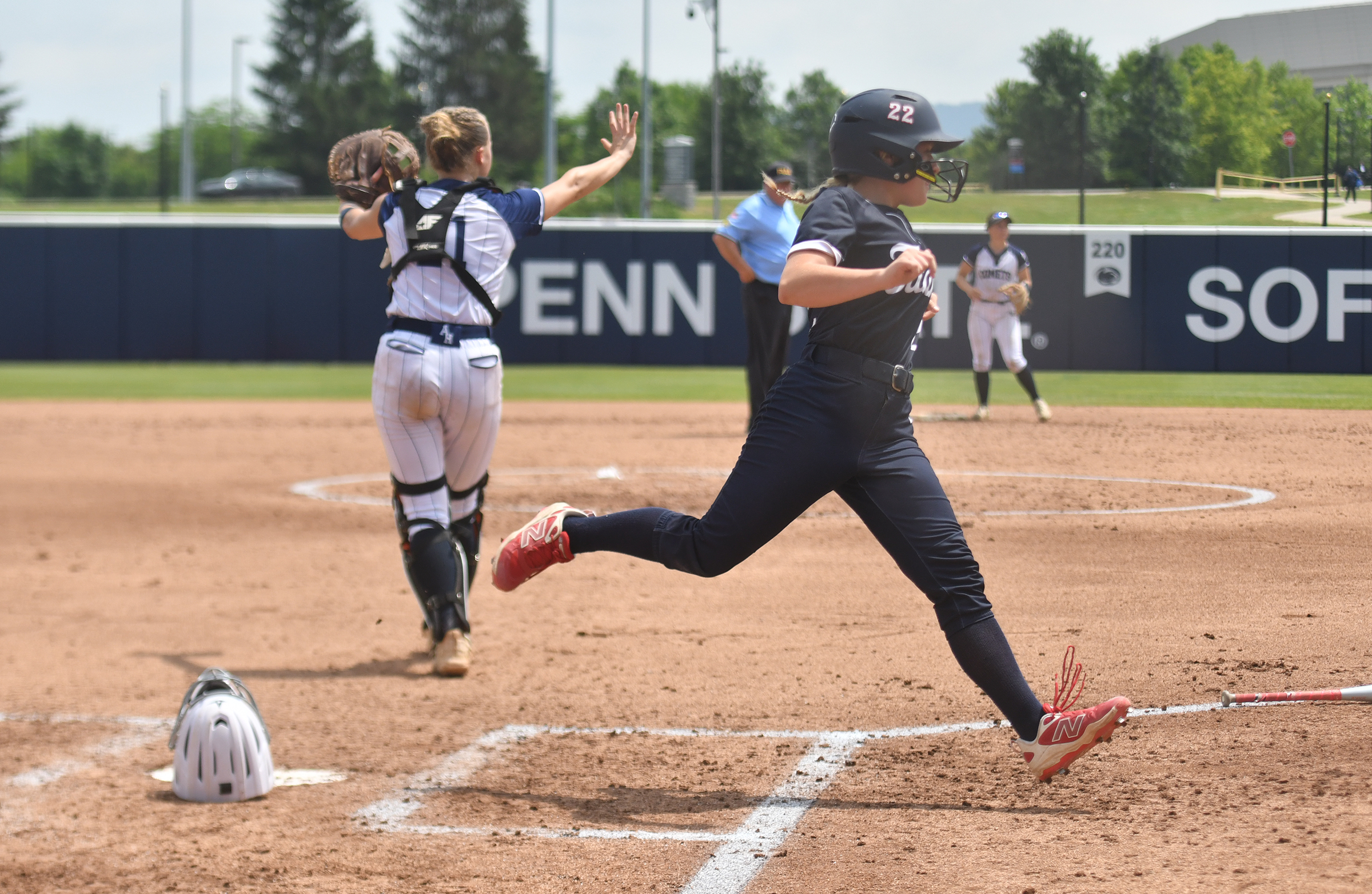 Shaler’s Ella Hergenroeder scores a run as Abington Heights catcher...