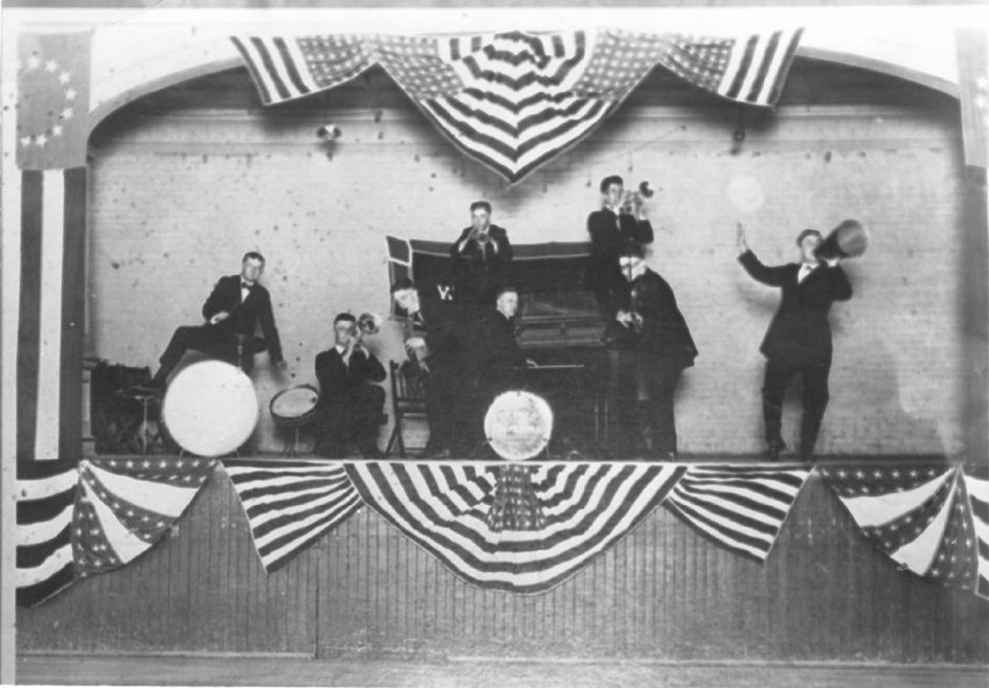 A band entertains on stage during the vaudeville era in...