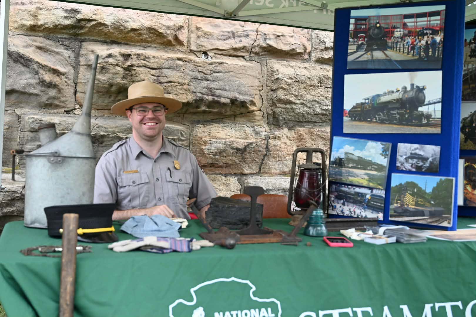 Steamtown park ranger Christopher Carey offers educational items and information...