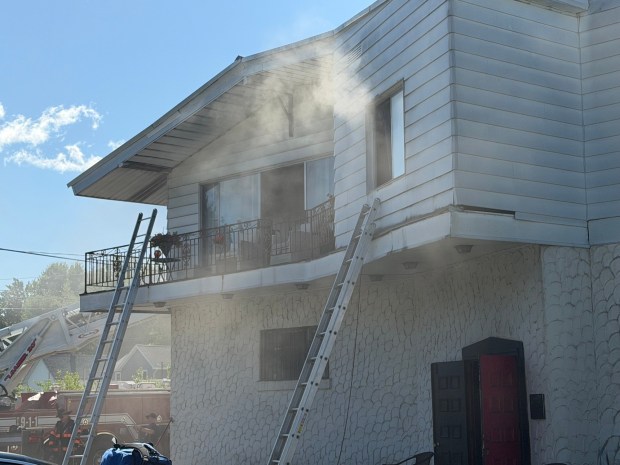 Two people were displaced following a fire Monday morning at the former Tomaino's Lounge property on North Main Street in Archbald. (ROBERT TOMKAVAGE/STAFF PHOTO)