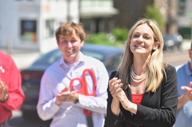 Scranton Mayor Paige Gebhardt Cognetti applauds after a ribbon cutting ceremony announcing the streetscape improvement of Cedar Ave. in South Scranton on Monday, June 1, 2026. (SEAN MCKEAG/STAFF PHOTO)