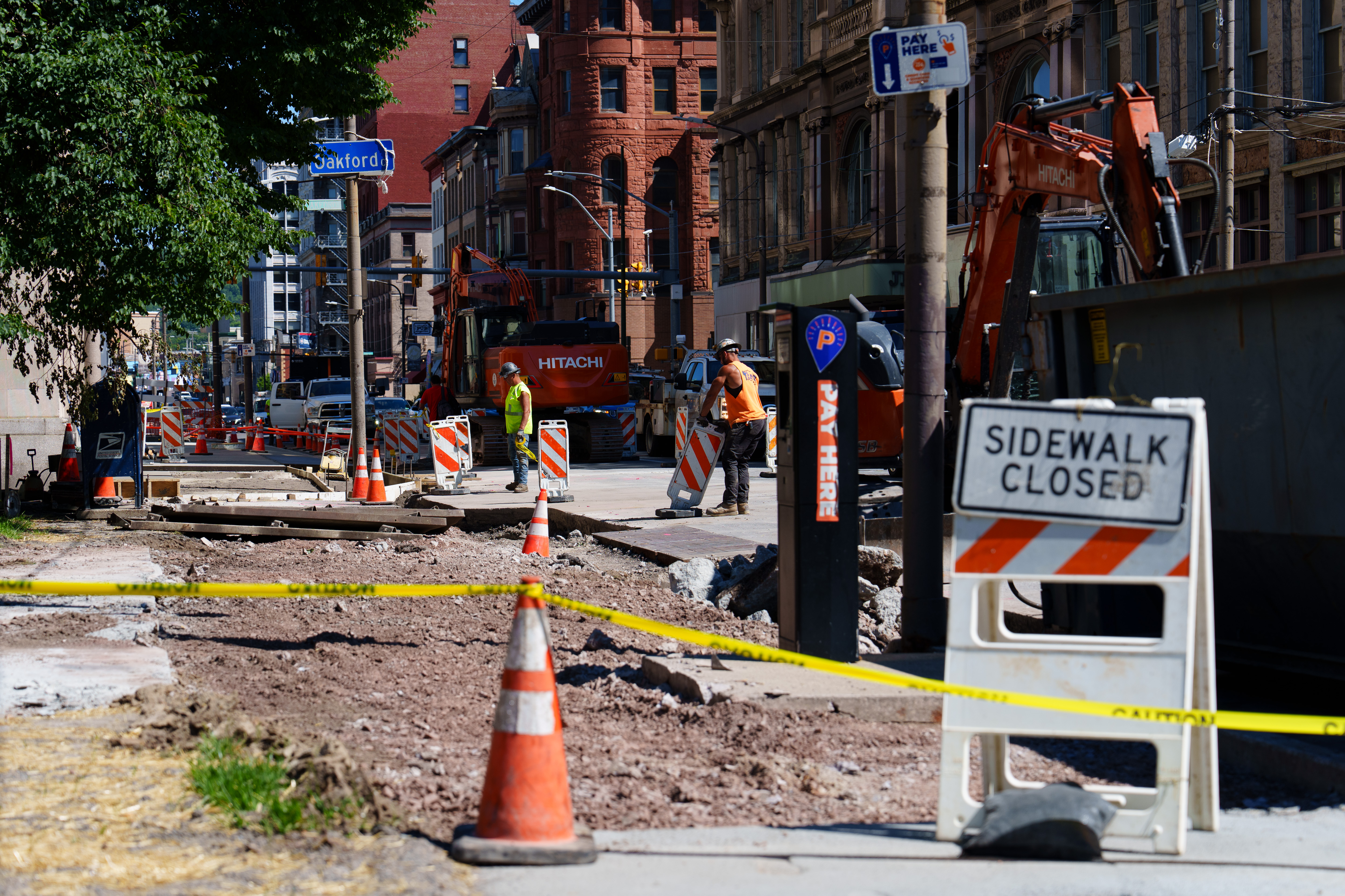 A section of sidewalk has been removed during construction on...
