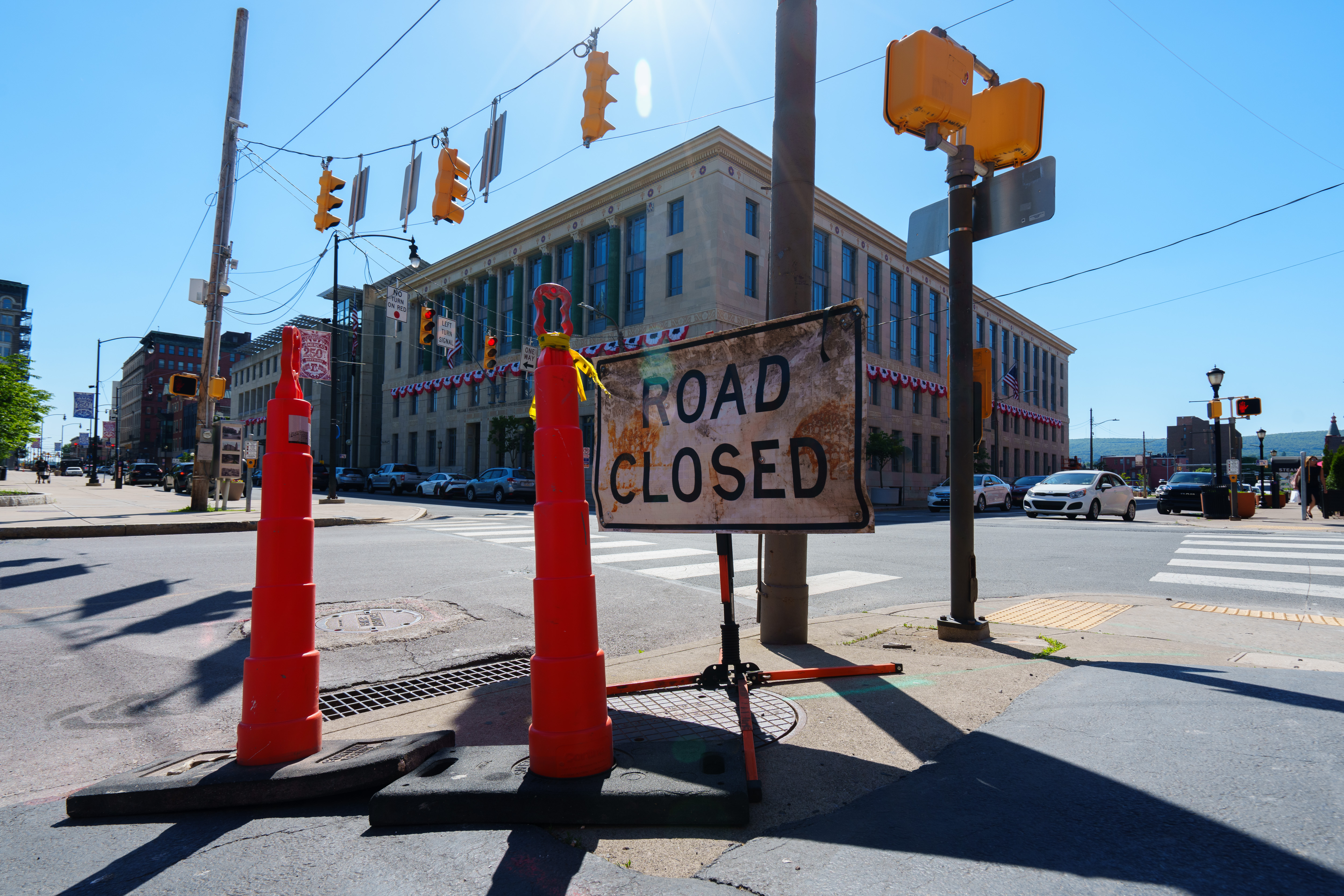 A “ROAD CLOSED” sign stands on the corner of North...