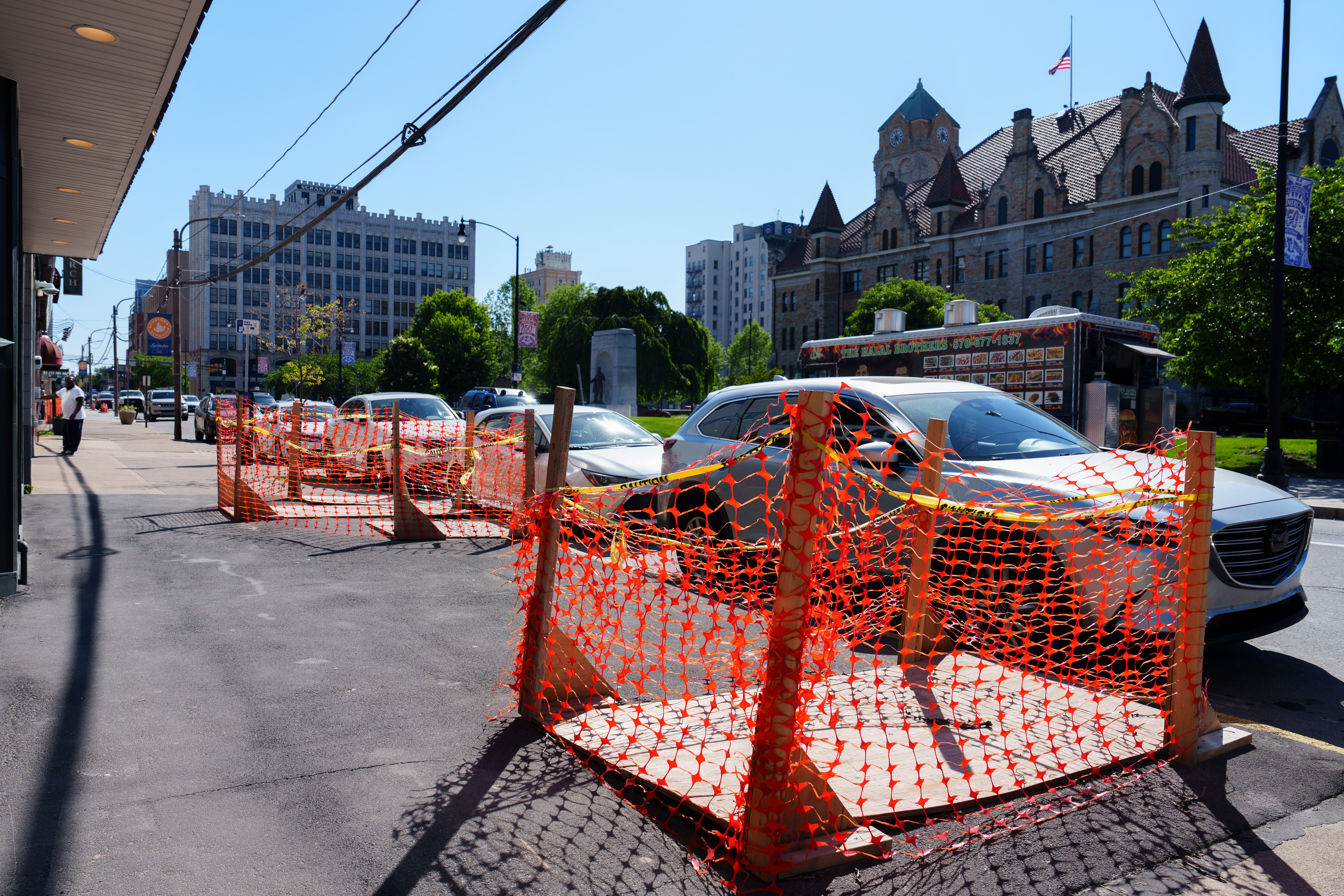 Portions of the sidewalk on Adams Avenue remain closed due...