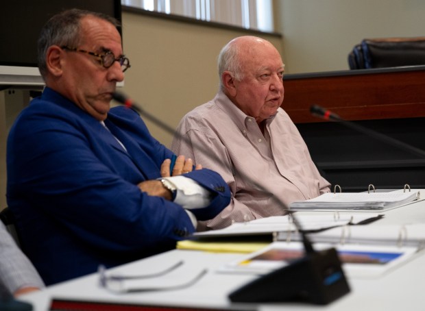 Dickson City Power's fact witness Randall Holmes, right, answers a question during a zoning hearing in the Dickson City Borough Building to consider special exceptions for three natural gas power plants on Wednesday, June 10, 2026. (FRANK WILKES LESNEFSKY / STAFF PHOTO)