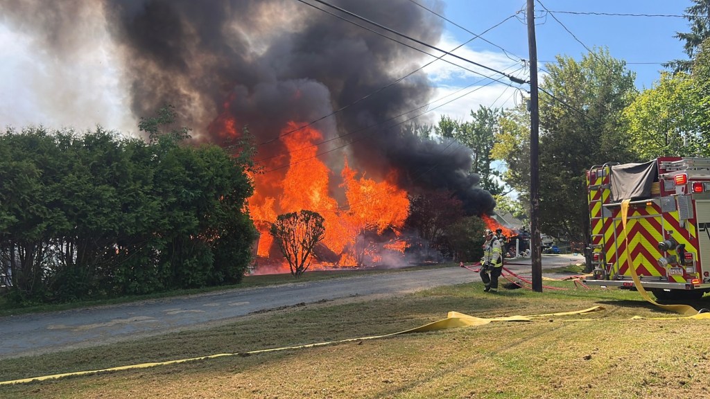 Massive fire, explosions level homes at Elk Lake; three taken to hospital