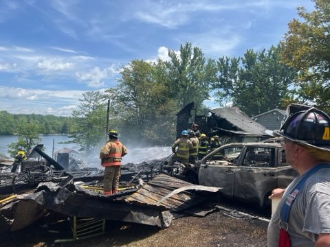 Emergency responders work at the scene after a series of...