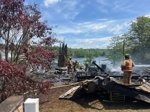 Emergency responders work at the scene after a series of...