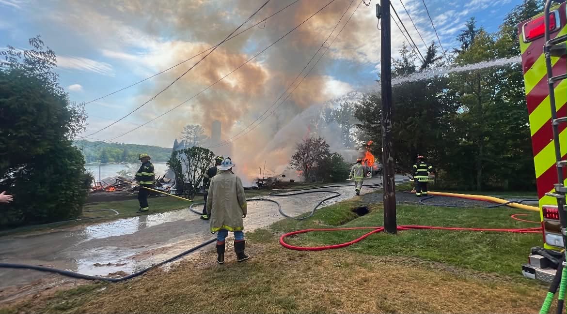 Emergency responders work at the scene after a series of...