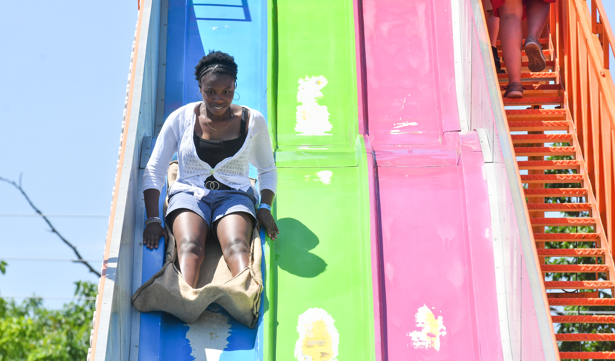 Angel George-Umoh, of Kingston, rides the Super Slide at the...