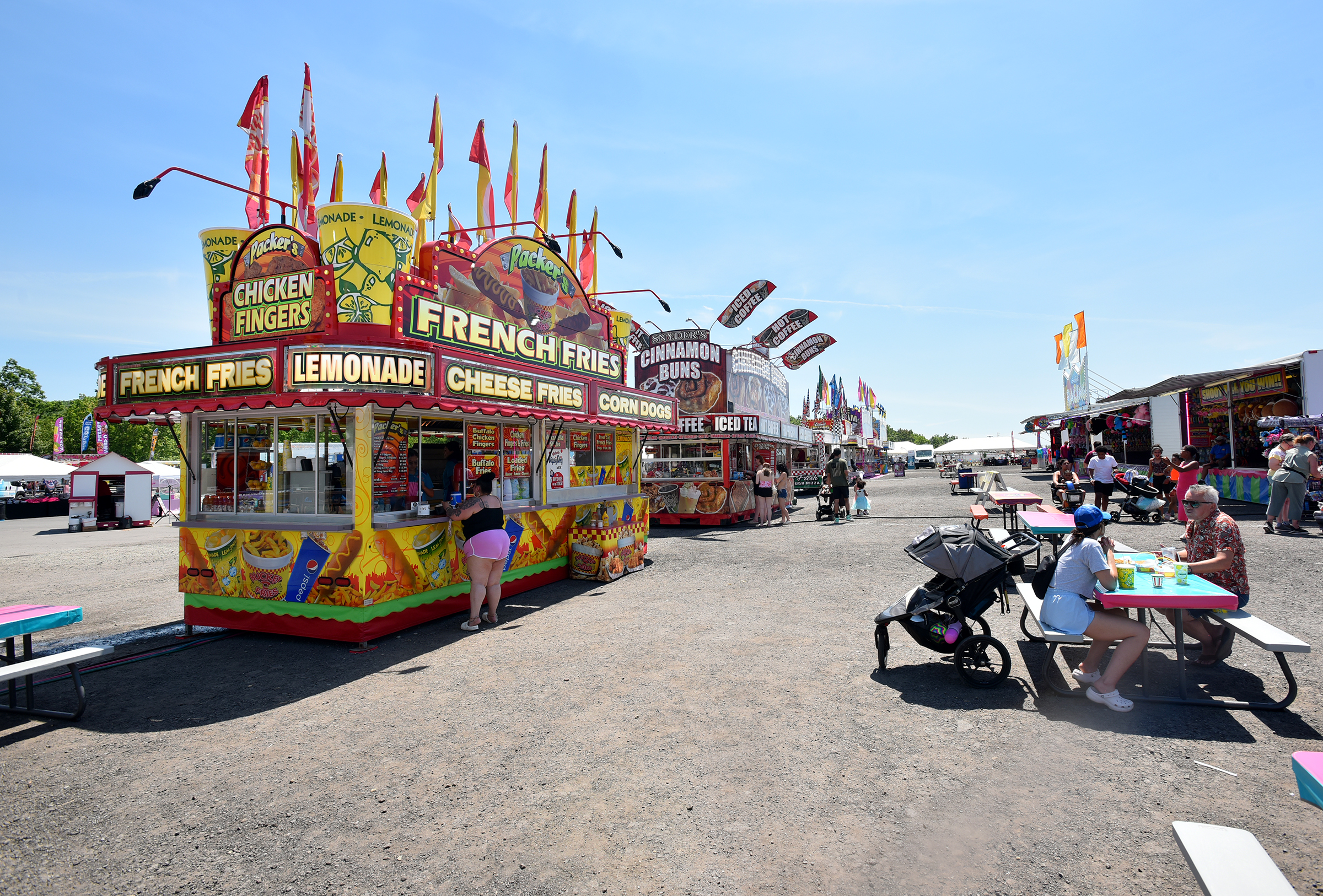 Patrons eat by the food stands during the Lackawanna County...