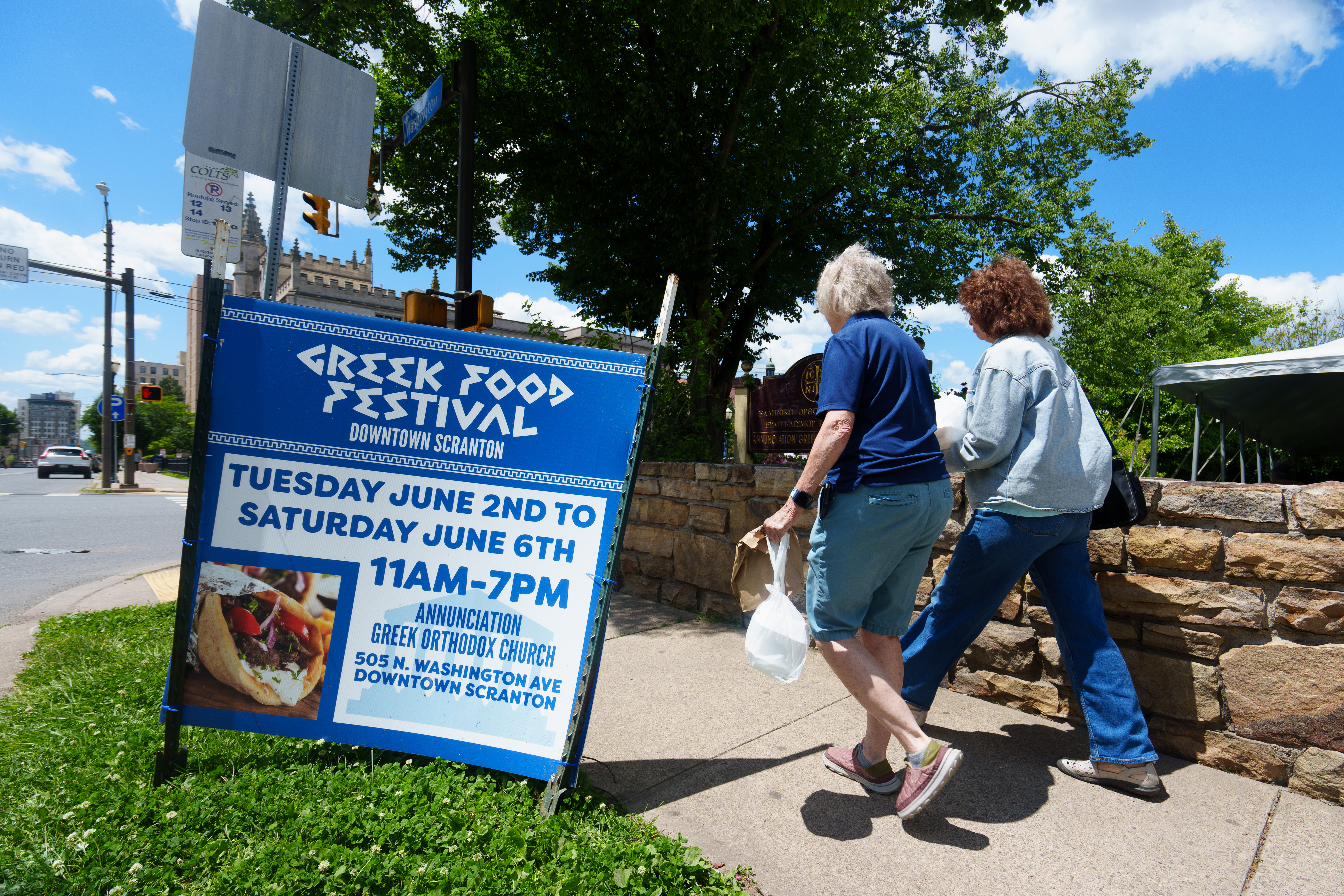 Customers leave the Greek Food Festival in Scranton, Pa., on...
