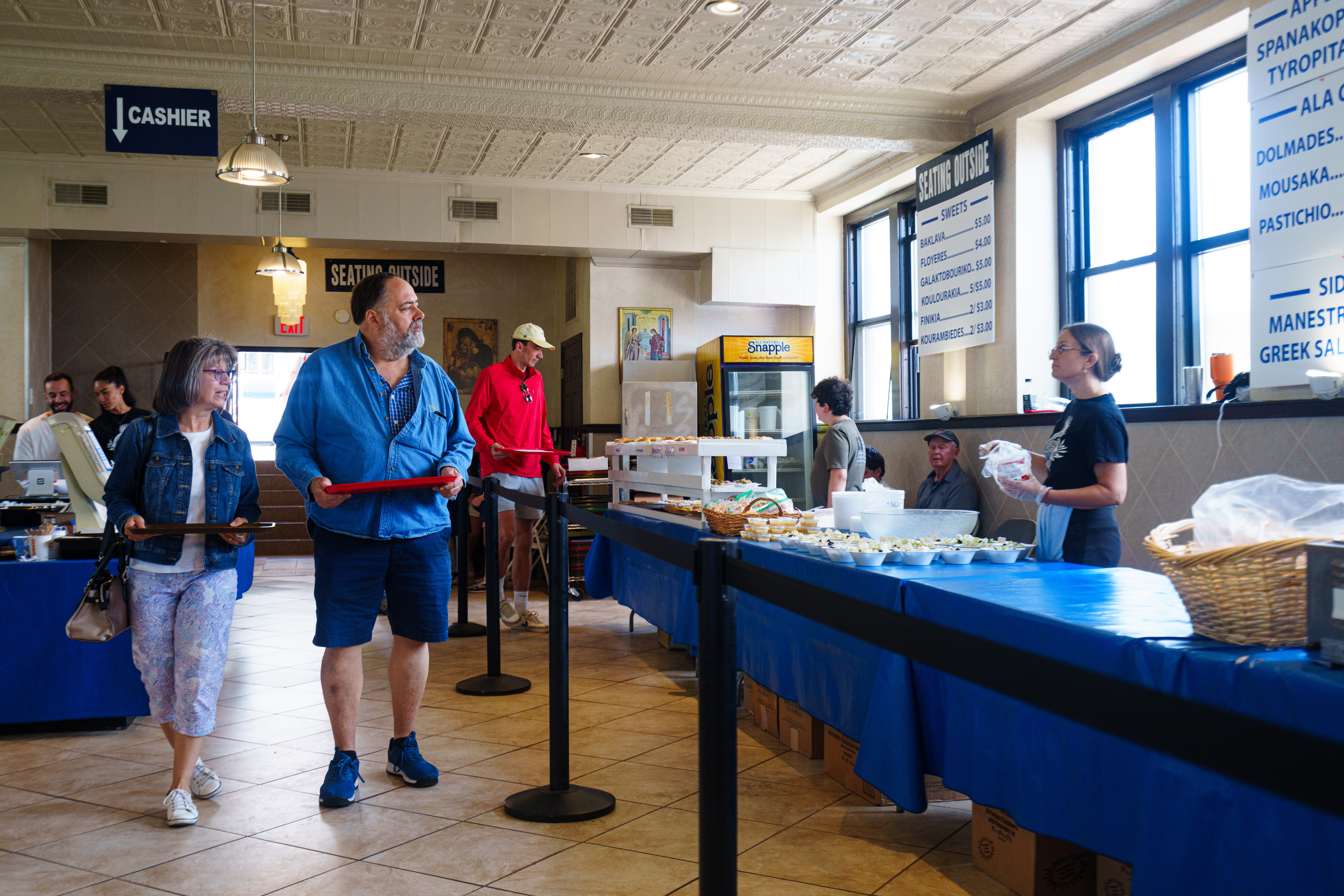 Customers browse food at the Greek at Annunciation Greek Orthodox...