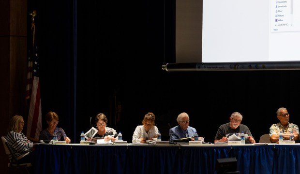 Archbald officials listen to testimony during a conditional use hearing at the Valley View High School auditorium in Archbald on Thursday, June 18, 2026. (FRANK WILKES LESNEFSKY / STAFF PHOTO)