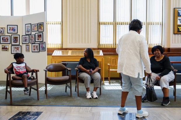 Attendees sit and talk during a Juneteenth open house hosted by the Black Scranton Project at the Black Scranton Project Center for Arts & Culture in Scranton, Pa., on Friday, June 19, 2026. (ISAAC DIAZ/STAFF PHOTO)