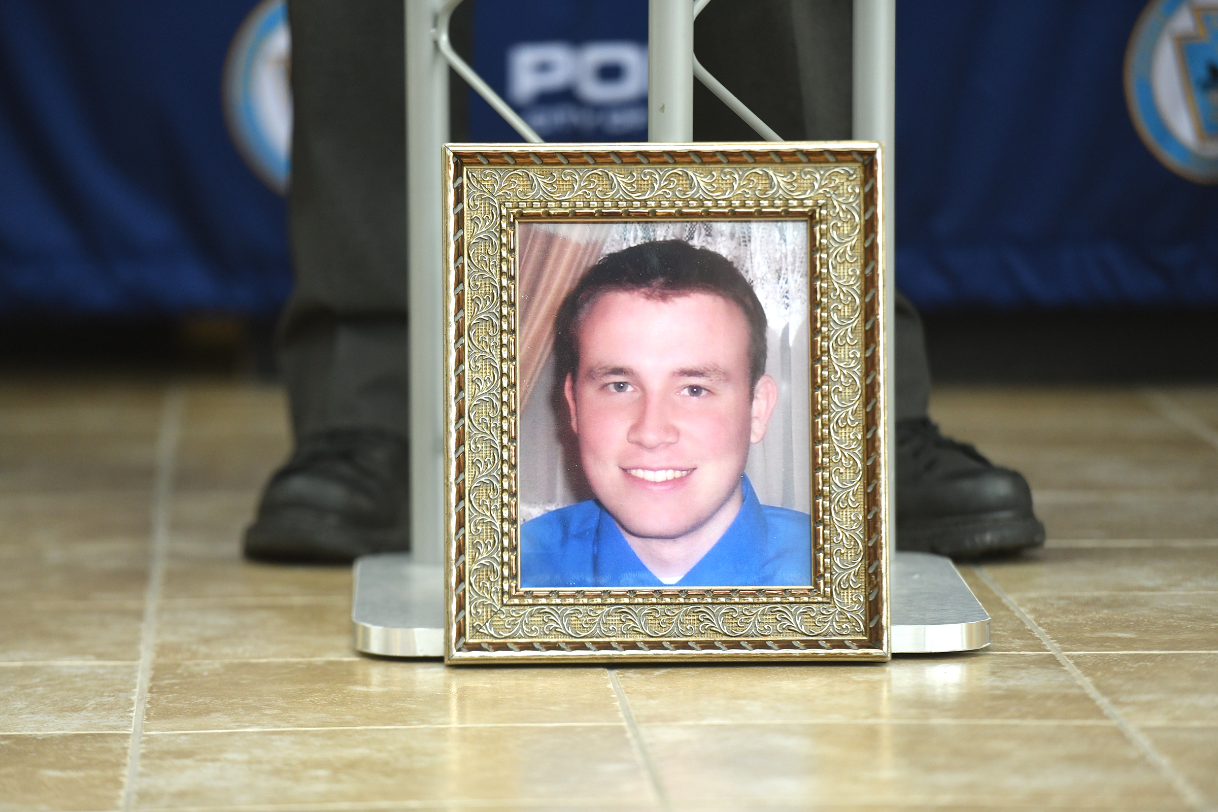 A framed photograph of Paull Miller Jr., who was killed...