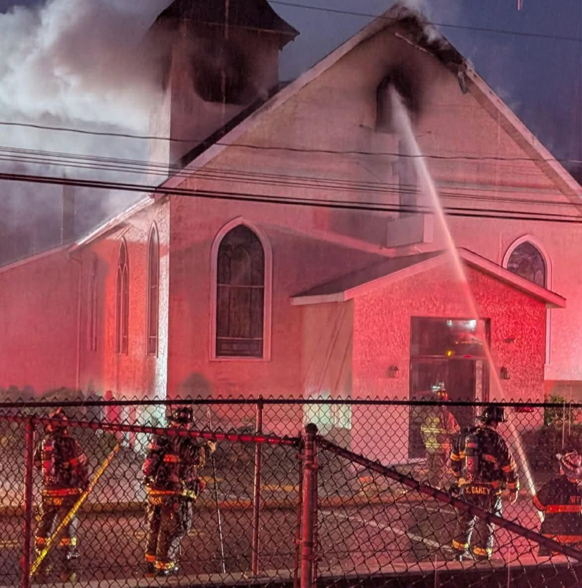 Firefighters fight flames at a church building in Peckville on...