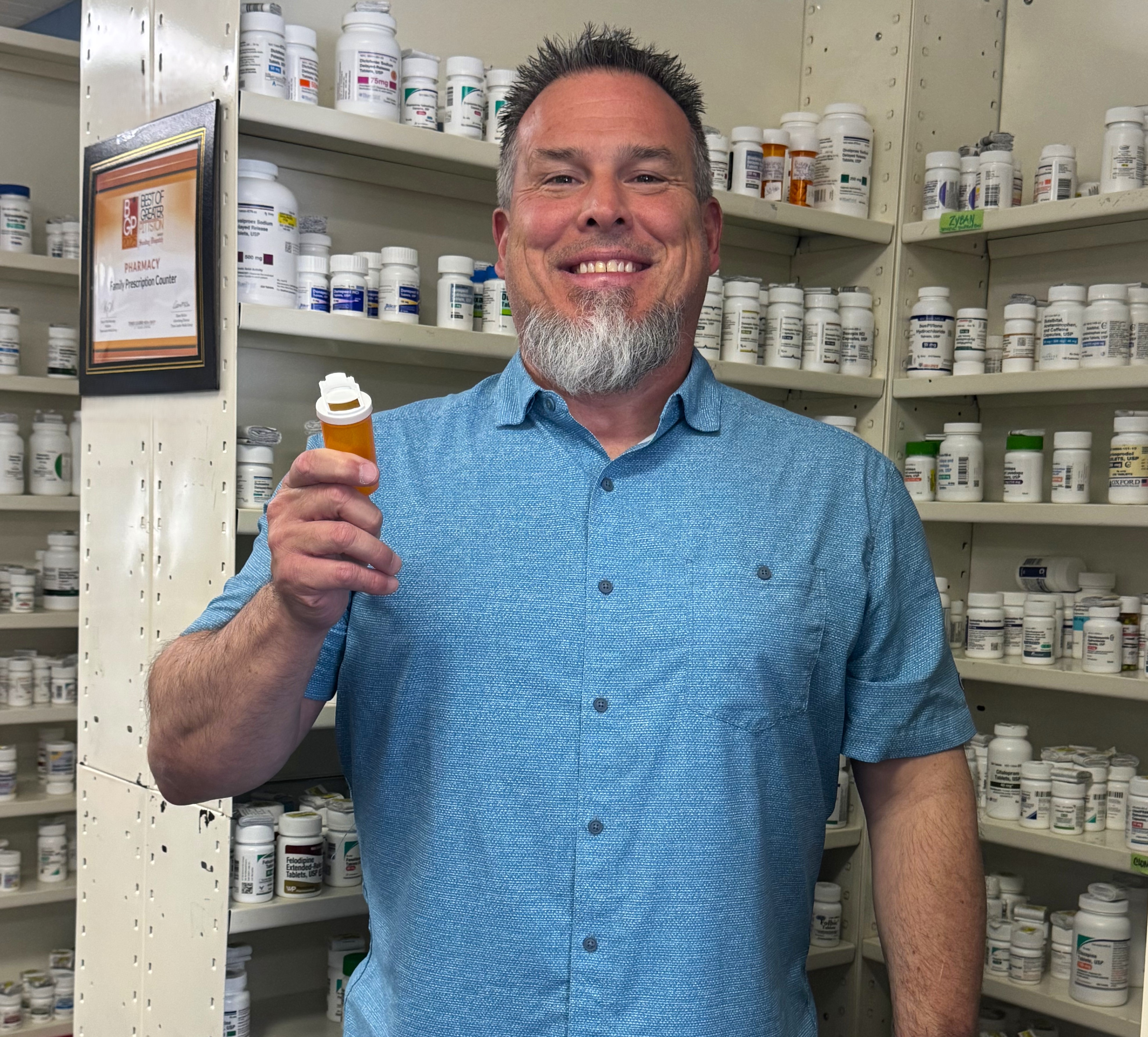 Chris Hampel, pharmacist at Family Prescription Counter in Duryea, shows...
