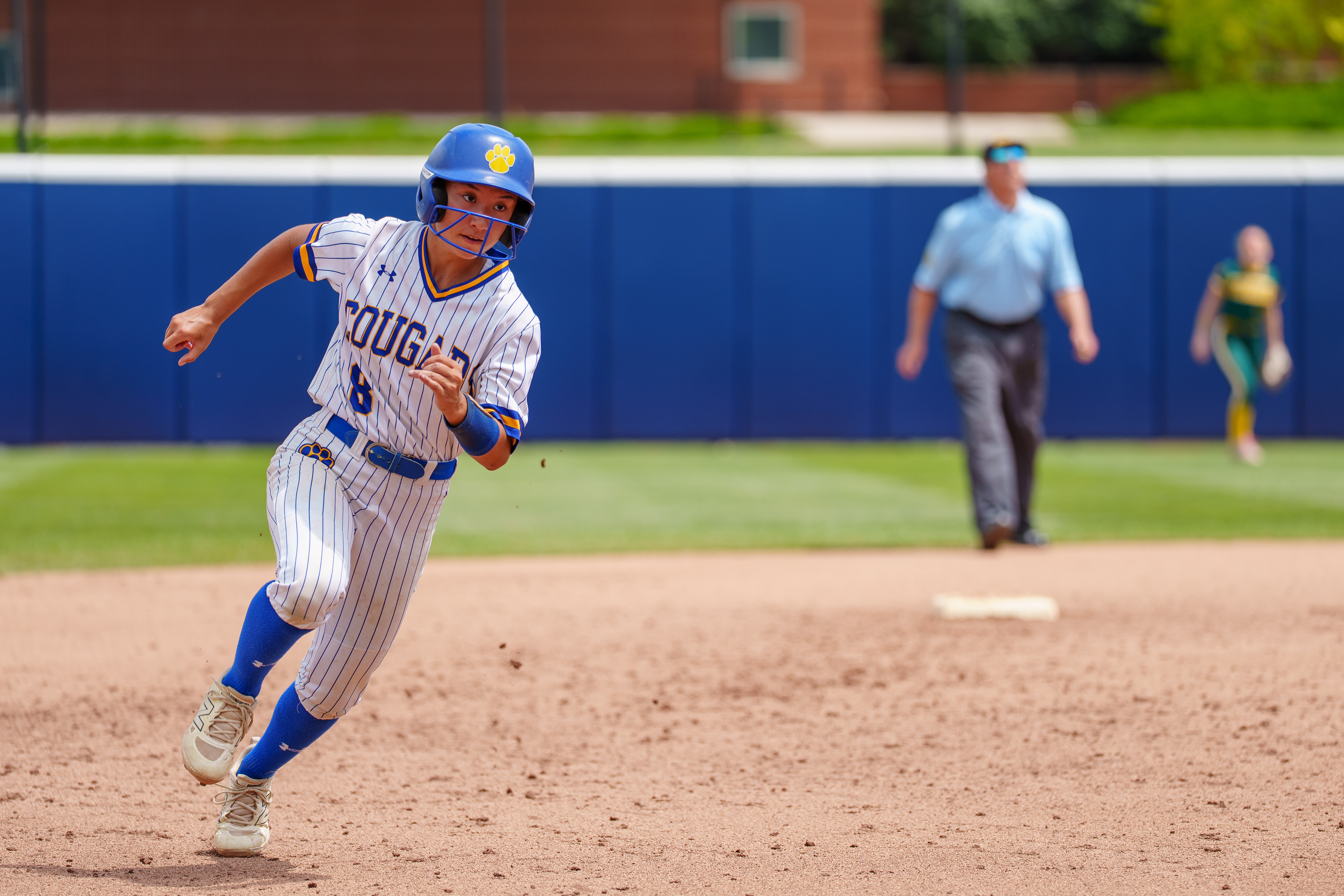 Valley View’s Ella Swingle advances from second base to third...