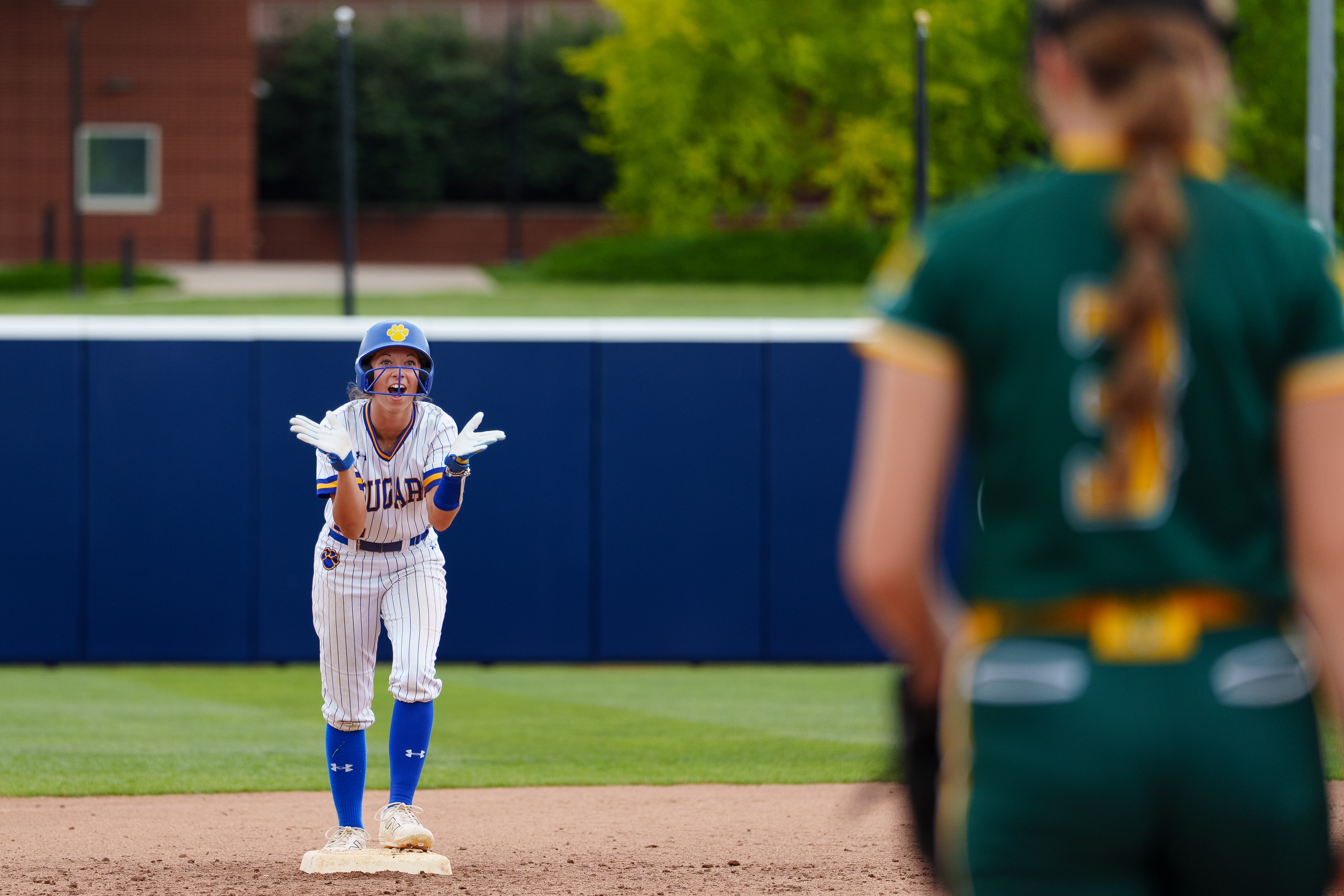 Valley View’s Mady Minelli applauds after reaching second base against...