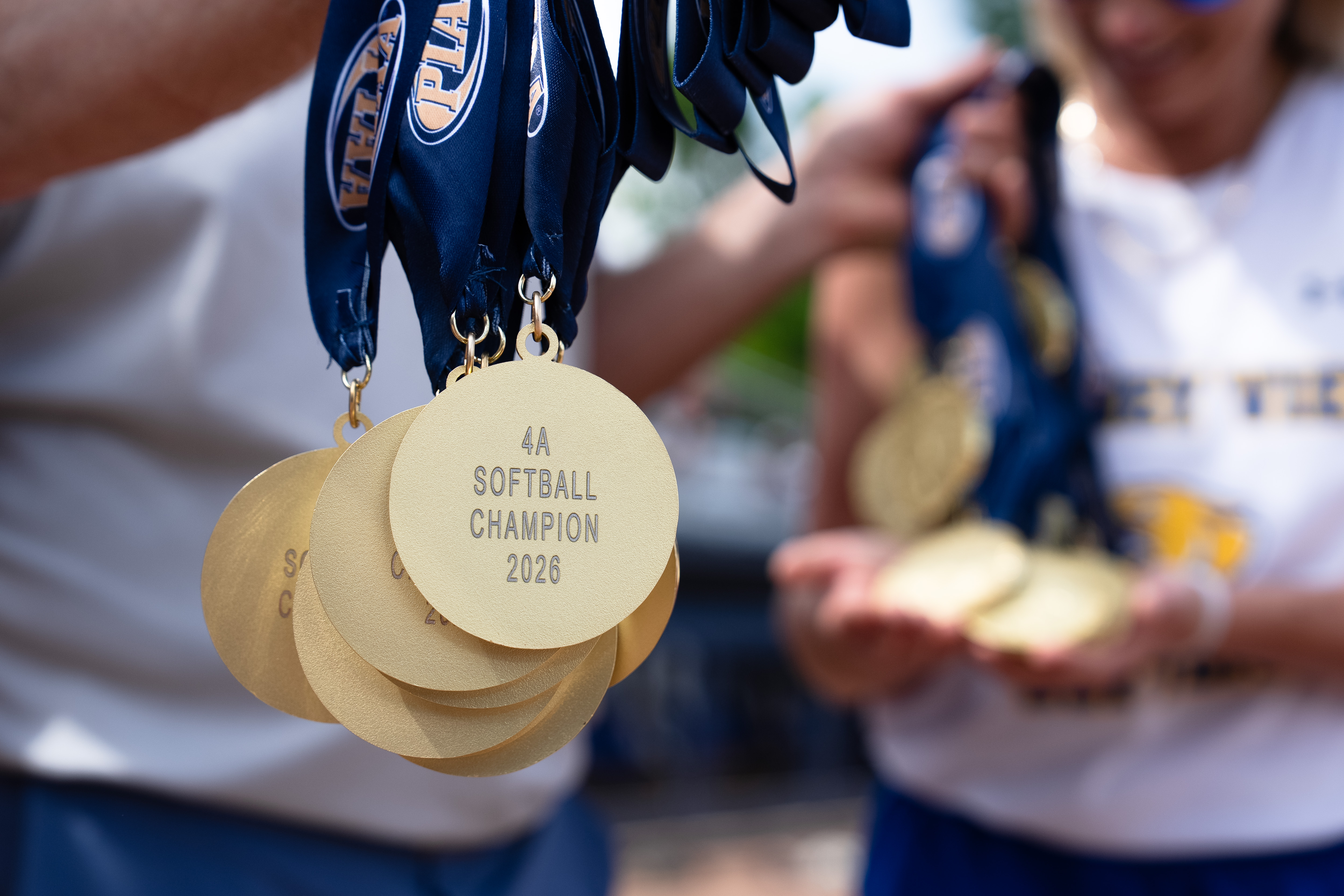 Valley View coaches hold medals after winning the PIAA Class...