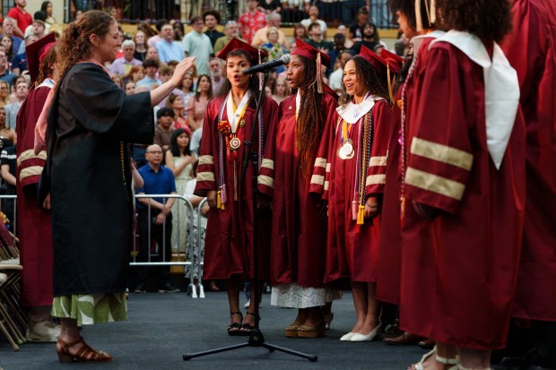 Graduates sing "The Star-Spangled Banner" during the Scranton High School graduation ceremony in Scranton, Pa., on Tuesday, June 9, 2026. (ISAAC DIAZ/STAFF PHOTO)