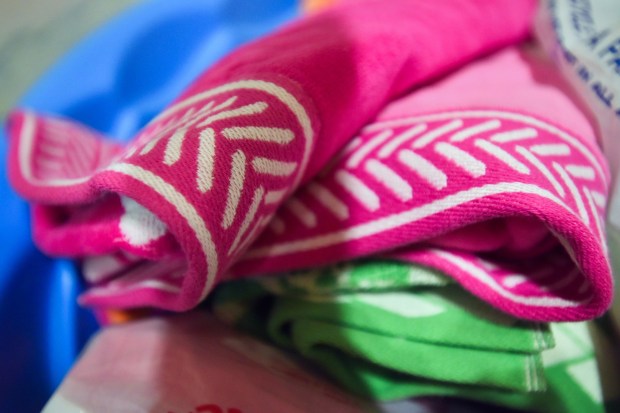 Donated swim towels are seen in Mary, Mother of God Parish at Holy Rosary Church in North Scranton Thursday, June 18, 2026. (SEAN MCKEAG / STAFF PHOTOGRAPHER)